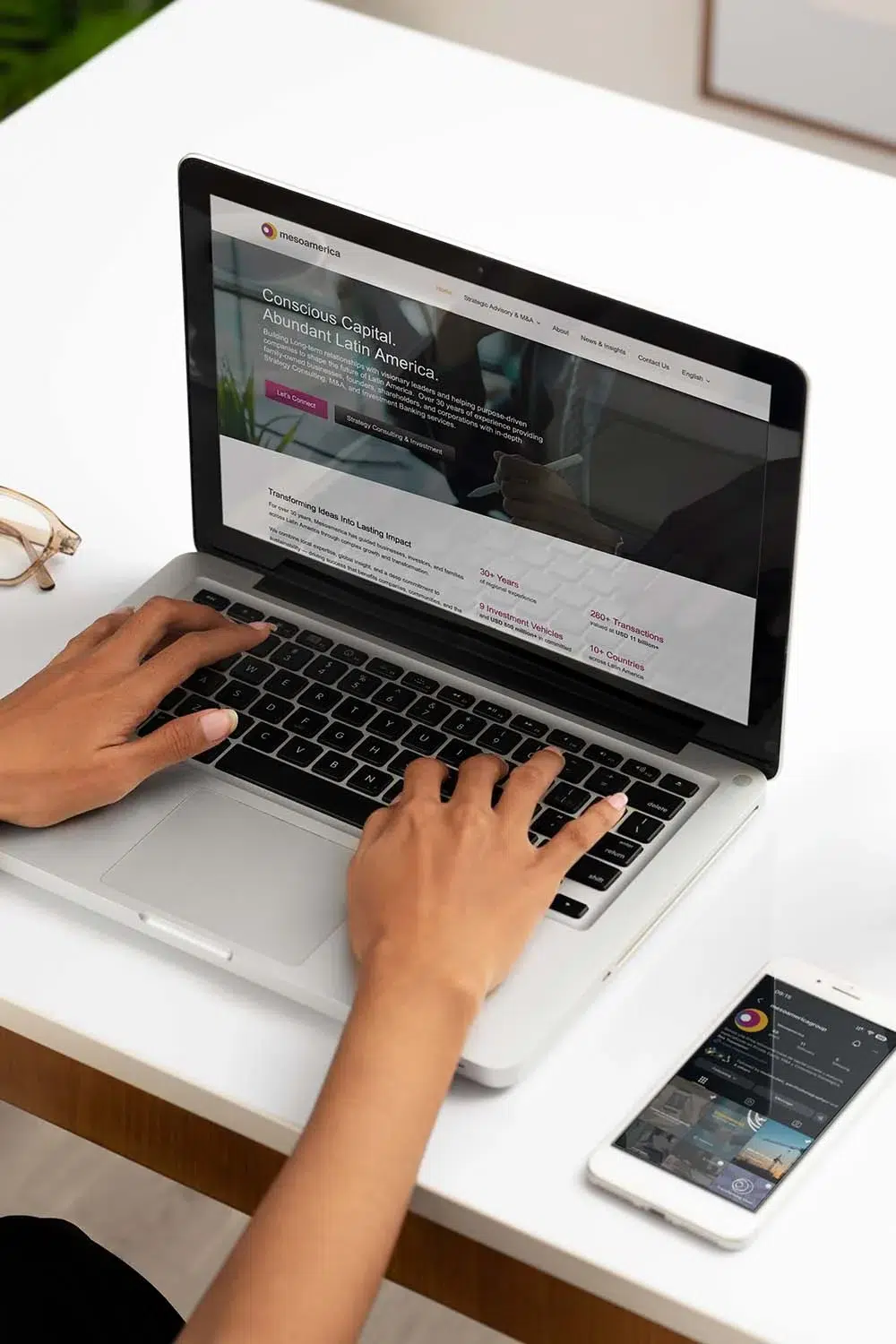 all-in-one marketing plan showing iphone and macbook by Pacific Marketing reviewing tour and rental website by Pacific